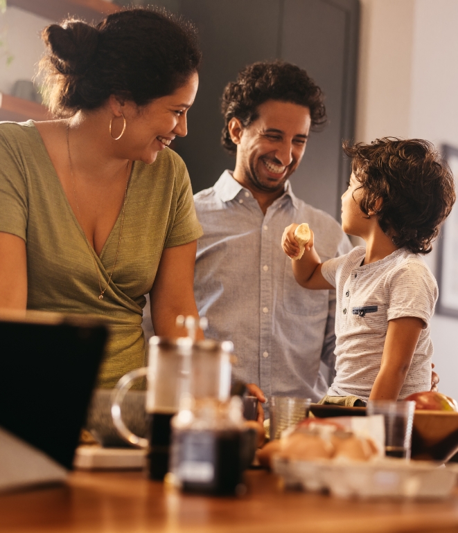 Happy family in the kitchen, they called T&T for HVAC & Plumbing Services in Huntertown, IN